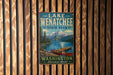 A vintage-style metal sign for Lake Wenatchee State Park, featuring a scenic image of a lake, mountains, and a canoe.
