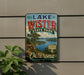 A vintage-style sign for Lake Wister State Park in Oklahoma, featuring a scenic landscape with a lake and mountains.