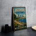 A vintage-style sign for Lakeshore State Park in Milwaukee, Wisconsin, featuring a scenic image of the park and its surroundings.