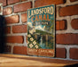 A vintage-style metal sign for Landford Canal State Park in South Carolina, featuring a scenic illustration of the canal and surrounding landscape.