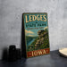 A vintage-style sign for LEDGES STATE PARK in Iowa, featuring a scenic illustration of a rocky cliff and a river.