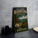 A vintage-style metal sign for Levi Jackson Wilderness Road, State Park, Kentucky, featuring a scenic landscape with a cabin and a trail.