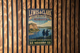 A vintage-style metal sign for Lewis & Clark State Recreation Area in Nebraska, featuring a scenic illustration of a river and mountains.