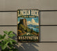 A vintage-style metal sign for Lincoln Rock State Park in Washington, featuring a scenic landscape with a mountain, lake, and forest.