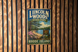 A vintage metal sign for Lincoln Woods State Park in Rhode Island, featuring a scenic landscape with a lake, pine trees, and a sign indicating the park's location.