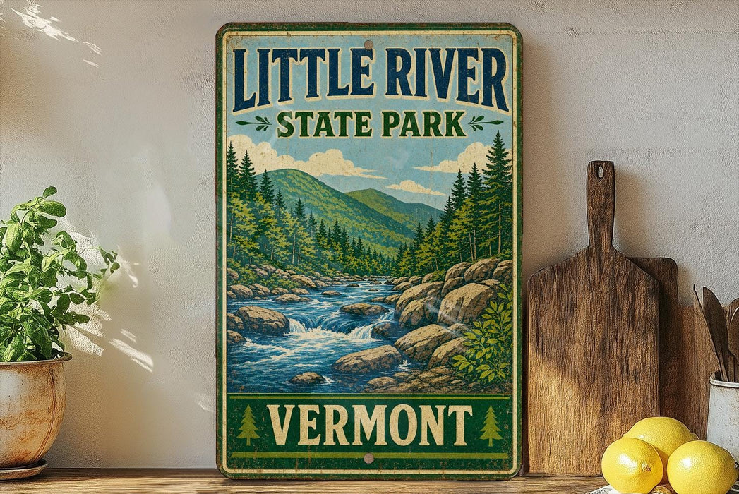 A vintage-style sign for Little River State Park in Vermont, featuring a scenic illustration of a river surrounded by mountains and pine trees.