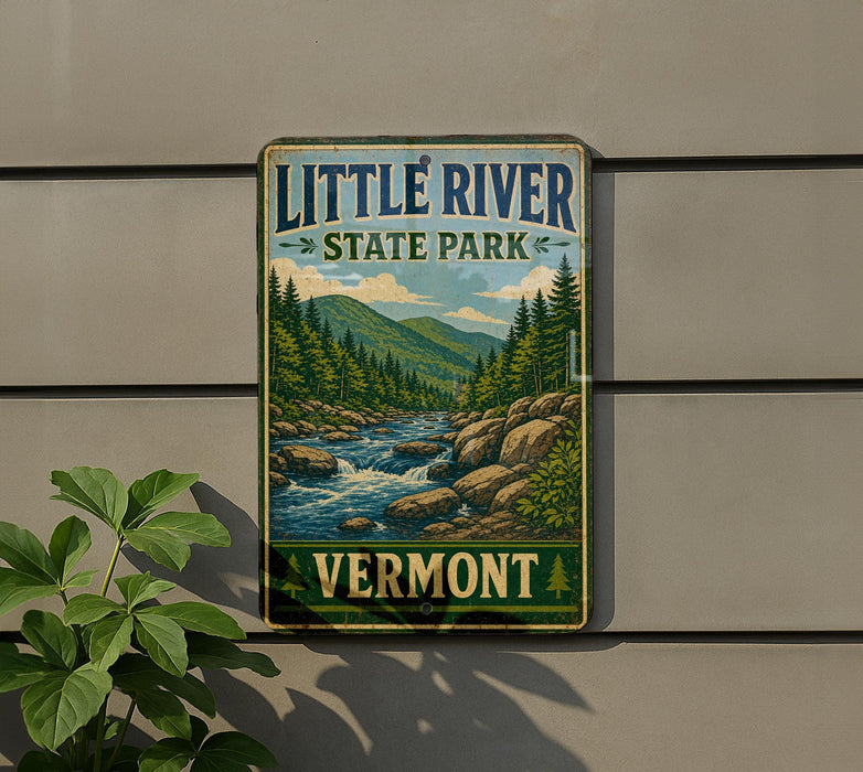 A vintage-style sign for Little River State Park in Vermont, featuring a scenic illustration of a river surrounded by mountains and pine trees.