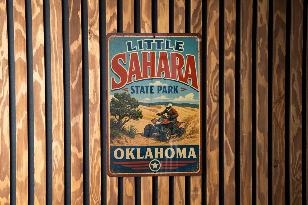 A vintage metal sign for Little Sahara State Park in Oklahoma, featuring an illustration of a person riding an ATV in a desert landscape.