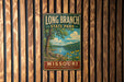 A vintage-style metal sign for Long Branch State Park in Missouri, featuring a scenic landscape with a tree, a lake, and flowers.