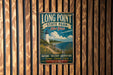 A vintage metal sign for Long Point State Park in New York, featuring a lighthouse and a scenic landscape.