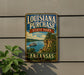 A vintage-style sign for Louisiana Purchase State Park in Arkansas, featuring a scenic illustration of a river and a steamboat.