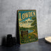 A vintage-style sign for Lowden State Park in Illinois, featuring a scenic landscape with a lake and trees.