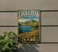 A vintage-style metal sign for Lucky Peak State Park in Idaho, featuring a scenic landscape with mountains, a lake, and wildflowers.