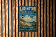 A vintage-style metal sign for Ludington State Park in Michigan, featuring a lighthouse and a scenic landscape.