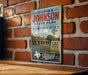 A vintage-style metal sign for the Johnson State Park and Historic Site in Texas, featuring a house and a windmill in the background.