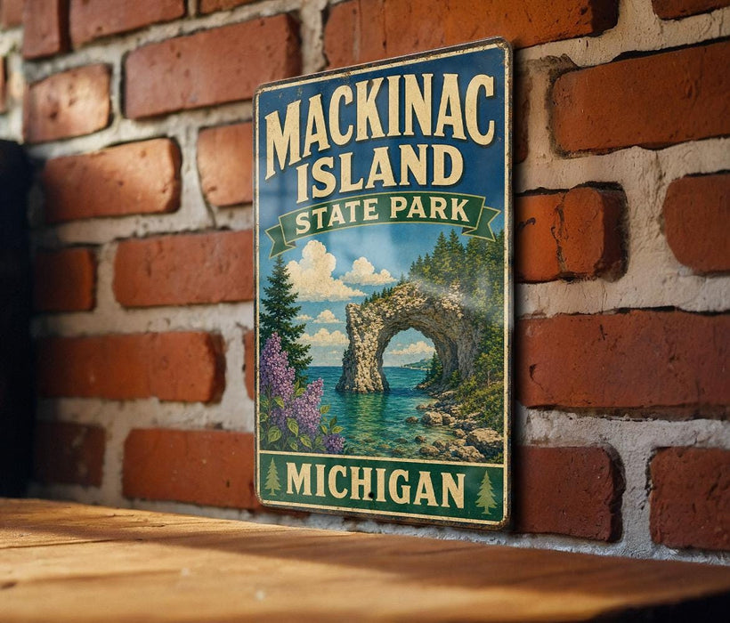 A vintage-style metal sign for Mackinac Island State Park in Michigan, featuring a scenic landscape with a bridge, water, and trees.