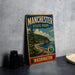 A vintage-style metal sign for Manchester State Park in Washington, featuring a scenic landscape with pine trees, a beach, and a body of water.