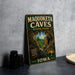 A vintage-style metal sign for the Maquoketa Caves State Park in Iowa, featuring a scenic image of the cave system and the park's name.