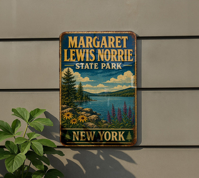 A vintage-style metal sign for Margaret Lewis Norrie State Park in New York, featuring a scenic landscape with pine trees, a lake, and mountains.