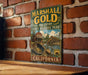 A vintage metal sign for Marshall Gold Discovery State Historic Park in California, featuring an illustration of a panning gold mine and a wooden bridge.