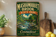 A vintage-style metal sign for Mashamogueet Brook State Park, featuring a scenic illustration of a river and forest.