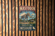 A vintage metal sign for the state historic site called "Mastodon" in Missouri, featuring an illustration of a skeleton of a large elephant.