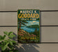 A vintage-style metal sign for Maurice K. Goddard State Park in Pennsylvania, featuring a scenic landscape with a lake, mountains, and trees.