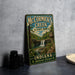 A vintage-style metal sign for McCormick's Creek State Park in Indiana, featuring a scenic illustration of the creek and waterfall.