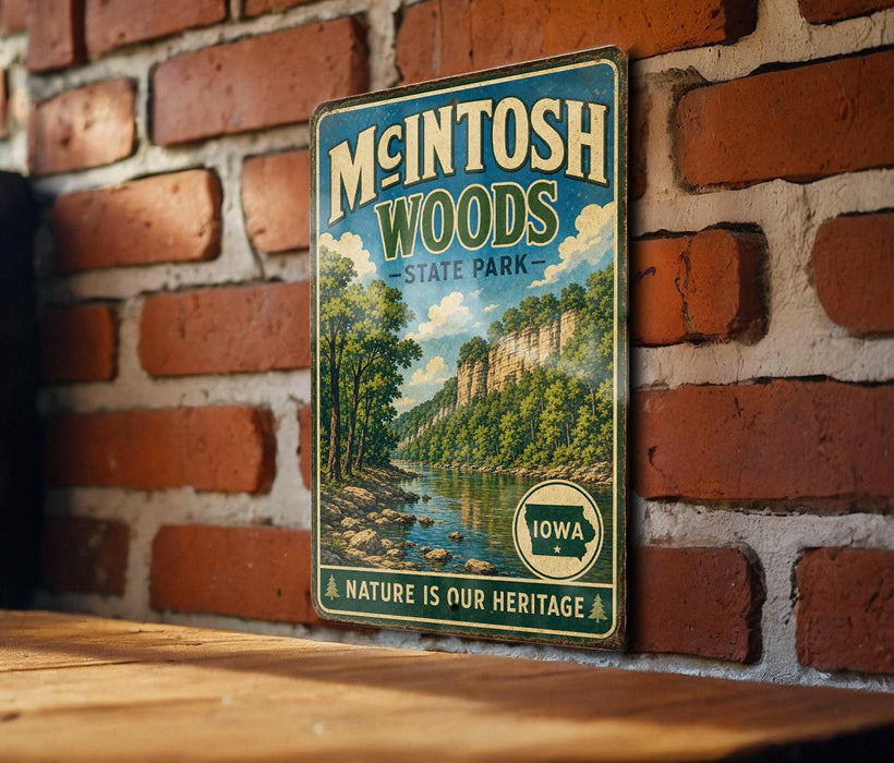 A vintage-style metal sign for Mcintosh Woods State Park in Iowa, featuring a scenic landscape with a river and trees.