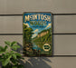A vintage-style metal sign for McIntosh Woods State Park in Iowa, featuring a scenic landscape with a river and lush greenery.