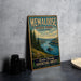 A vintage-style metal sign for Memalose State Park, Oregon, featuring a scenic landscape with a river and mountains.