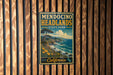 A vintage-style metal sign for Mendo Cino Headlands State Park in California, featuring a scenic landscape with a coastal cliff and ocean.