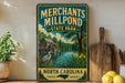 A vintage-style sign for "Merchants Mill Pond State Park" in North Carolina, featuring a scenic illustration of a mill pond surrounded by trees and wildlife.