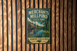 A vintage-style metal sign for "Merchants Mill Pond State Park" in North Carolina, featuring a wooden fence and a scenic landscape.