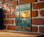A vintage-style metal sign for the Meredosia National Wildlife Refuge in Illinois, featuring an illustration of a heron and ducks in a natural setting.