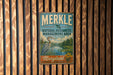 A vintage metal sign for Merkle Natural Resources Management Area in Maryland, featuring a blue background with a white bird and a river.