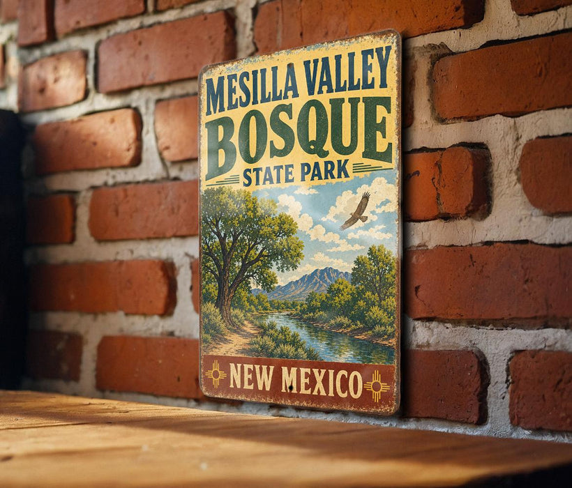 A vintage metal sign for Mesilla Valley Bosque State Park in New Mexico, featuring a scenic landscape with a river and mountains.