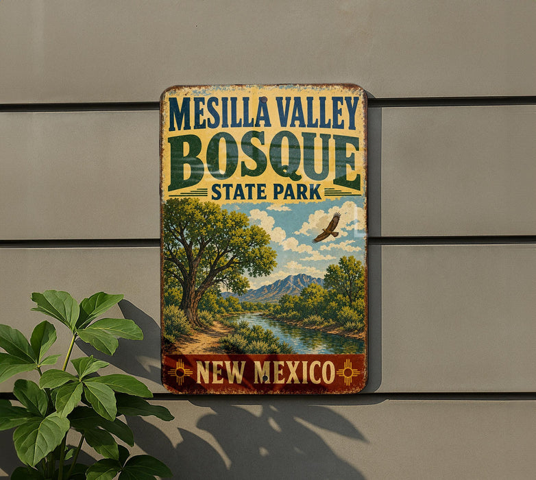 A vintage-style metal sign for Mesilla Valley Bosque State Park in New Mexico, featuring a scenic landscape with a river, mountains, and a bird in flight.