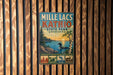 A vintage metal sign for Mille Lacs State Park in Minnesota, featuring a scenic landscape with a lake, trees, and wildlife.