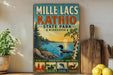A vintage-style sign for Mille Lacs State Park in Minnesota, featuring a scenic image of a lake, trees, and wildlife.