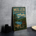 A vintage metal sign for Miller State Park, featuring a scenic landscape with a lake, mountains, and pine trees.