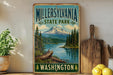 A vintage-style metal sign for Millersville State Park in Washington, featuring a scenic mountain landscape with a lake and pine trees.