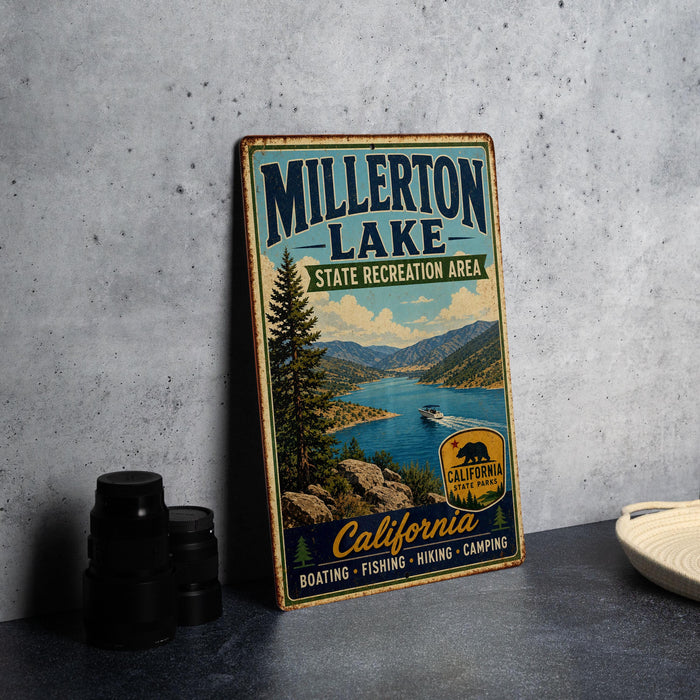 A vintage metal sign for Millerton Lake, a state recreation area in California, featuring a scenic image of the lake and mountains.