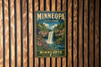 A vintage-style metal sign for Minnesota State Park, featuring a waterfall and lush greenery, is displayed on a wooden wall.