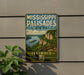 A vintage-style metal sign for Mississippi Palisades State Park in Illinois, featuring a scenic landscape with a river, cliffs, and a boat.