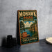 A vintage-style metal sign for Mohawk Park, Oklahoma, featuring a scenic landscape with a lake and mountains.