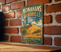 A vintage-style metal sign for Monahans Sandhills State Park in Texas, featuring a desert landscape with a cactus and a road leading to a sand dune.