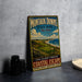 A vintage-style metal sign for Montauk Downs State Park in New York, featuring a scenic landscape with a golf course and ocean in the background.
