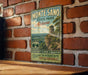 A vintage-style metal sign for Monte Sano State Park in Alabama, featuring a scenic mountain landscape and promoting the park's beauty and hiking opportunities.