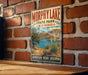 A vintage-style metal sign for Morphy Lake State Park in New Mexico, featuring a scenic landscape with a lake, mountains, and desert vegetation.